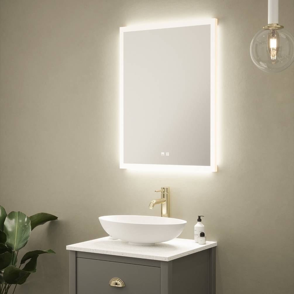 Product Lifestyle image of the Nina Colour Changing LED Mirror emitting warm white light